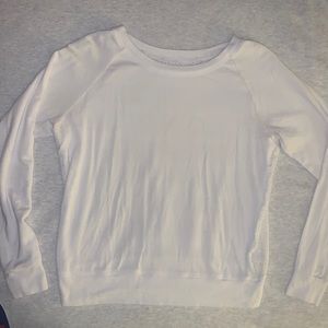 BeyondYoga white pullover. Size: Small. Front is solid with mesh like backing.